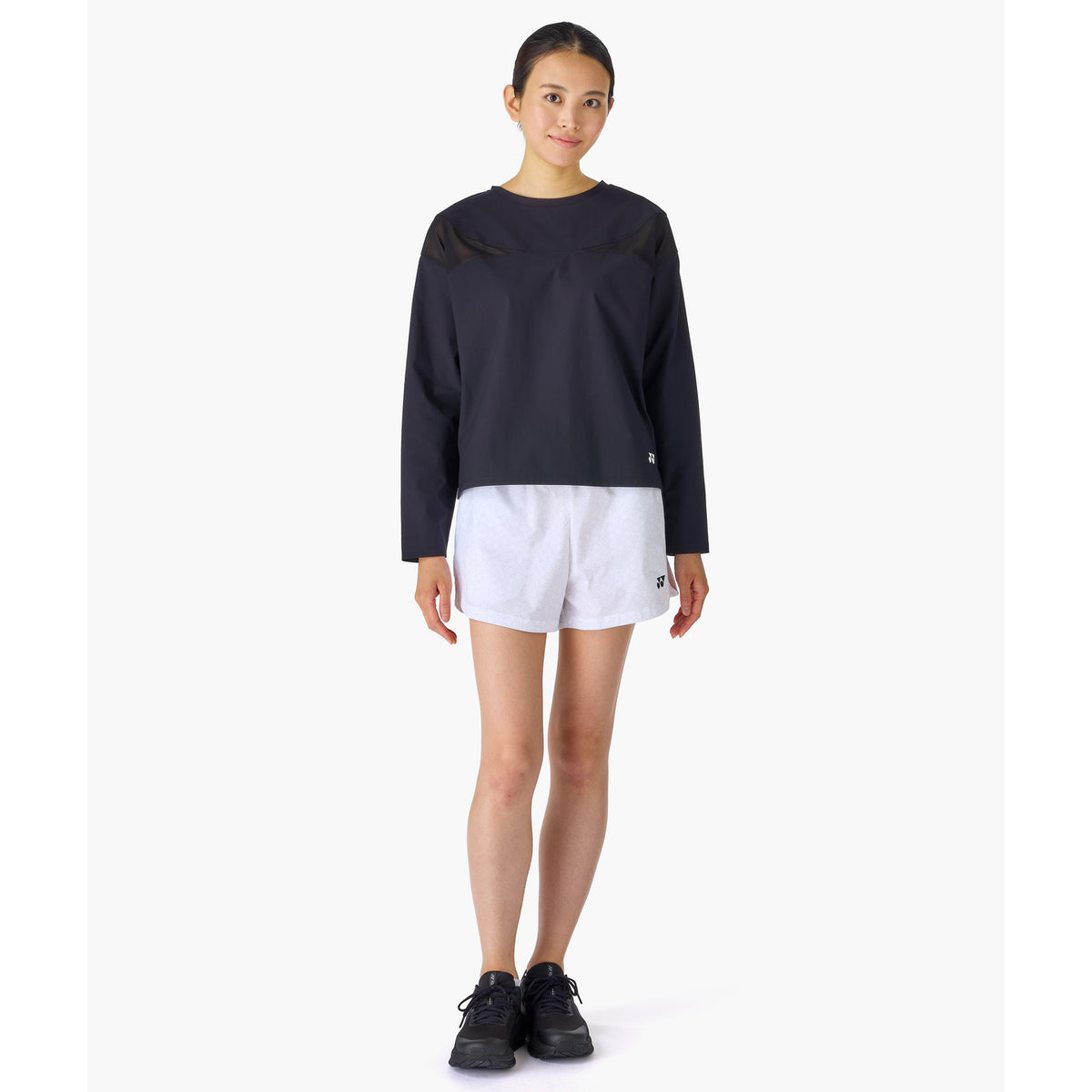 Yonex 25117 women's shorts in White - front view worn by a model