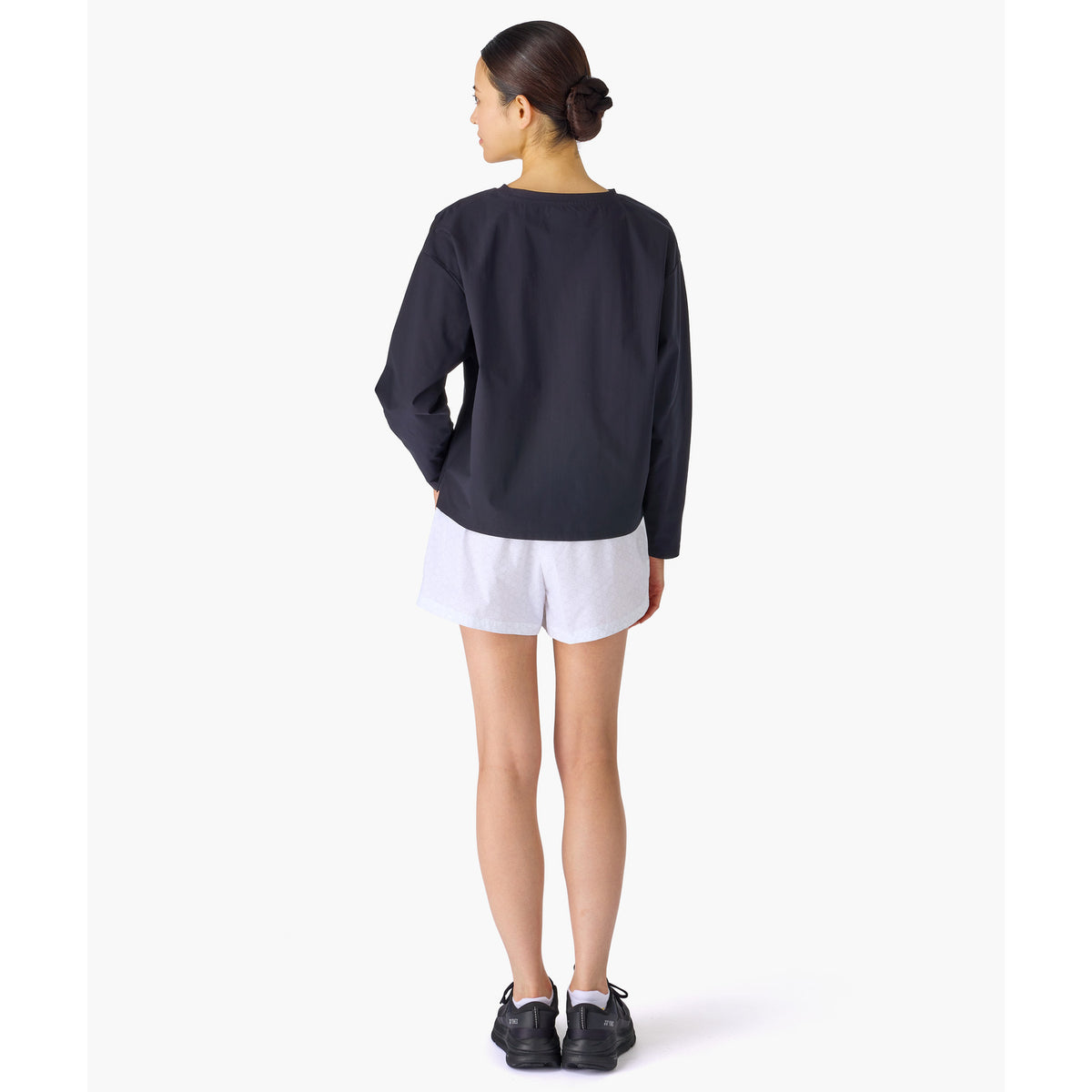 Yonex 25117 women's shorts in White - back view worn by a model
