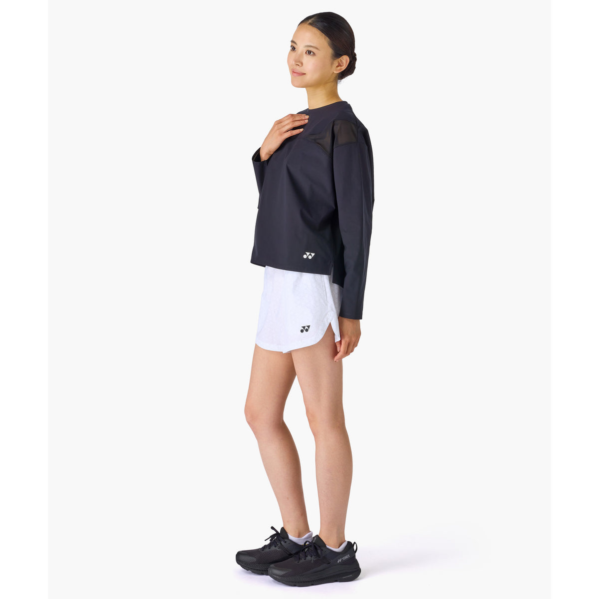 Yonex 25117 women's shorts in White - side view worn by a model