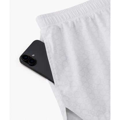 Yonex 25117 women's shorts in White - side pocket detail shown with a phone